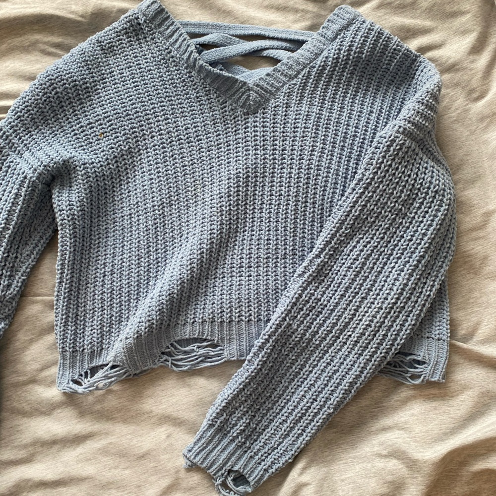 Distressed crossover cropped sweater